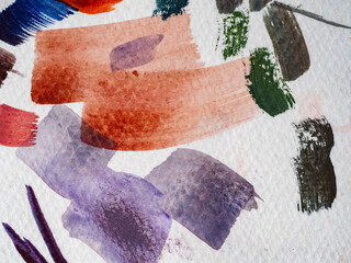 colored paint strokes on white paper