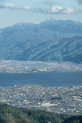 Obraz premium 高ボッチ高原から望む諏訪湖の夕景夜景 