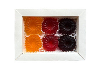 Fruit and berry marmalade in a white cardboard box. Isolated on white background.
