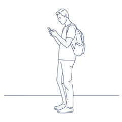 Focused Connection: A young man absorbed in his phone, standing still. Capture a moment of modern solitude and connectivity.