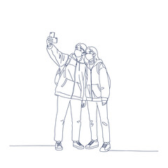 Selfie Moment in Pandemic Times: Capturing a moment of connection, two individuals, wearing face coverings, pause to capture a selfie, reflecting the realities of the times.