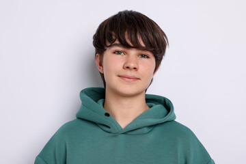 Portrait of teenage boy on white background