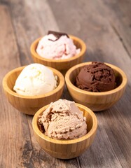 Fototapeta premium different ice cream in different small wooden bowl
