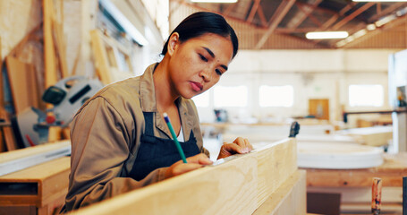 Carpentry, industry and pencil with woman in workshop for manufacturing or production process. Creative, design and measurement with carpenter in woodworking studio for craftsmanship or manual labor