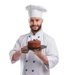 Happy confectioner in uniform holding delicious chocolate cake on white background