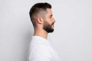 Man after scoliosis treatment on light background