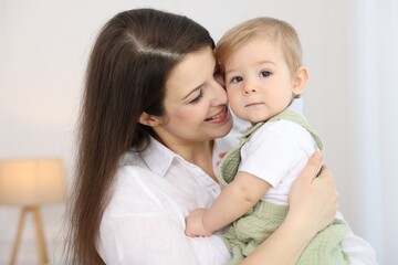 Mother with her cute little baby at home