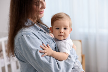Mother with her cute little baby at home