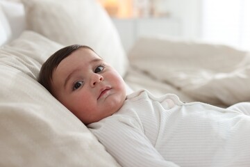 Bedtime. Cute little baby on bed at home
