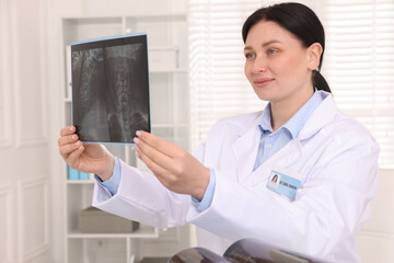 Doctor examining neck MRI scan in clinic