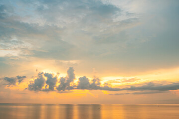 Nature beautiful light sunset or sunrise over sea surface,Colorful sunset sky with clouds and waves in the ocean,Wide angle sea background