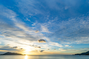 Fototapeta premium Nature beautiful light sunset or sunrise over sea surface,Colorful sunset sky with clouds and waves in the ocean,Wide angle sea background