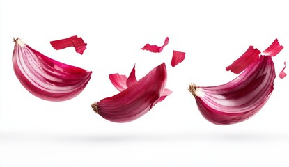 Fototapeta premium Red onions sliced, in mid-air, with flying pieces