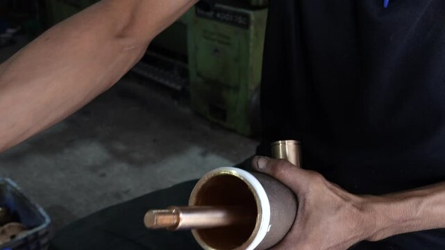 4k Close-up of a craftsman using a vernier to measure the size and distance of a piece of steel.