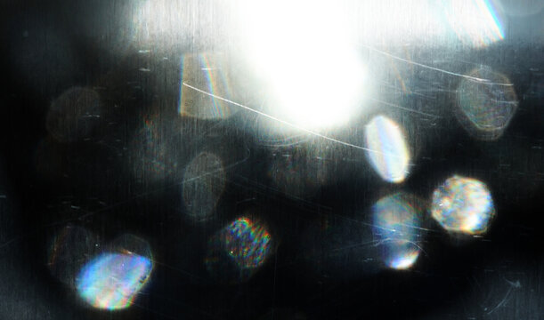 Abstract light leak effect in film camera. It's beautiful of lens flare with blurred background. There are noise, glitch and grains texture.