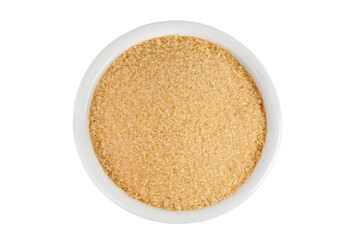 The brown sugar in ceramic bowl isolated on white background. Top view. Flat lay