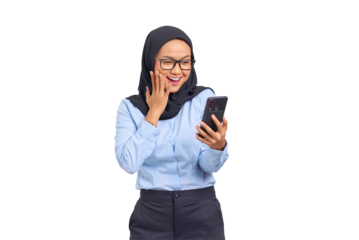 Portrait of cheerful young Asian woman looking at a mobile phone, reading good news isolated on transparent background