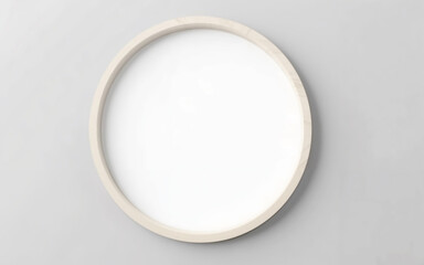 Minimalistic round mirror with a wooden frame on a light gray surface