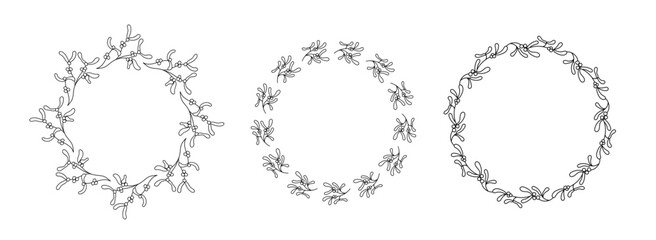 Elegant set of mistletoe wreath in linear style. Circular botanical frames with berries and leaves for Christmas greeting cards, invitations, packaging, and festive decor