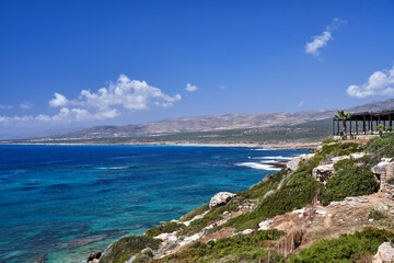 roofed terrace of a tavern on the rocky coast of the Mediterranean Sea on the island of Cyprus