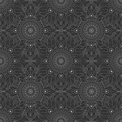 Mystical, sacred, natural motifs and abstract ornaments in a seamless pattern, dark color palette with bright botanical, floral details and circular ethnic patterns.