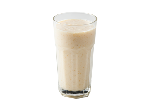 Creamy beige smoothie in a tall clear glass isolated on black