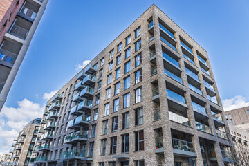Modern urban apartment building with balconies © SellStock