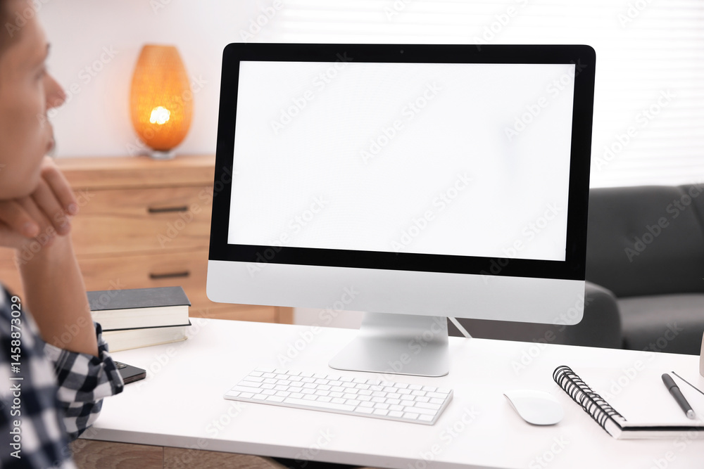 Poster man working on computer at white desk in office, closeup. mockup for design