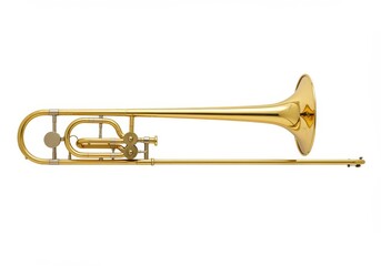 Obraz premium A shiny golden trombone lying horizontally on a white background in a studio shot
