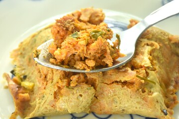 grilled chop pork curry in banana leave Thai northern food on plate