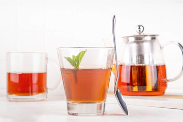 Black tea trendy asian dessert, diet non calorie sweet tea agar or gelatine jelly, in portioned glass, white table background copy space