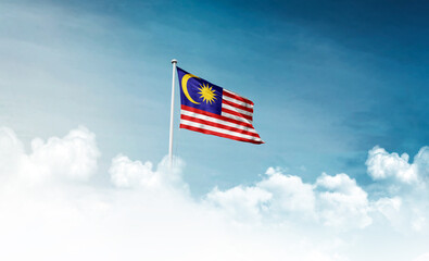 Malaysia national flag with mast waving in beautiful sky. Malaysia flag for Republic Day and...