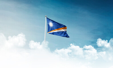 Marshall Islands national flag with mast waving in beautiful sky. Marshall Islands flag for...