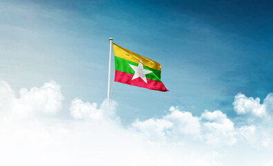 Myanmar (Burma) national flag with mast waving in beautiful sky. Myanmar Burma flag for Republic...