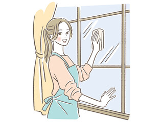窓を掃除する女性 