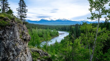 Serene river flows through lush green valley, snow-capped mountains in background, viewed from rocky cliffside. : Generative AI
