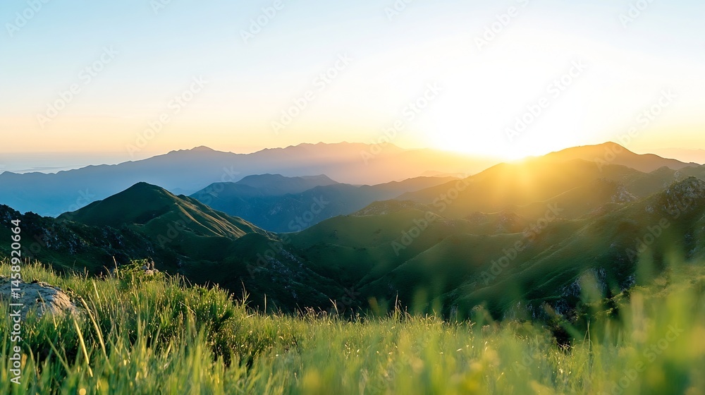 Poster sunrise over rolling green mountains, a breathtaking vista of layered peaks bathed in golden sunligh