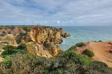 Picturesque Seaside Cliffs and Coastal Landscape Under Cloudy Sky
