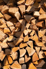 Stack of chopped firewood in sunlight