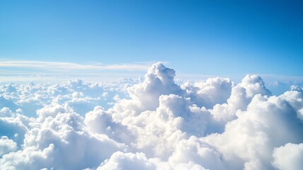 Naklejka premium Aerial view of fluffy cumulus cloudscape under a vibrant blue sky, offering a serene and peaceful atmosphere, perfect for travel or nature themes. : Generative AI