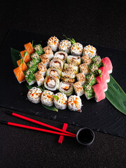 tasty sushi on the black background