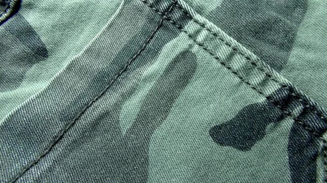 A close-up of a fragment of camouflage fabric for sewing
