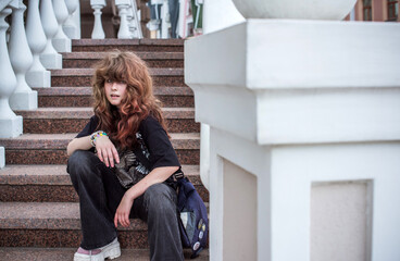 Teenage Girl in Denim Expressing Rebellion and Emotional Isolation