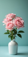 Fototapeta premium A bouquet of pink roses in a white vase against light blue background