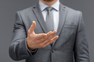 Fototapeta premium Man in Suit Reaching Hand Out