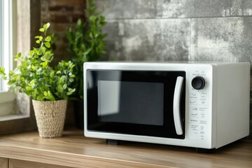 Fototapeta premium Minimalist modern microwave oven in clean kitchen interior