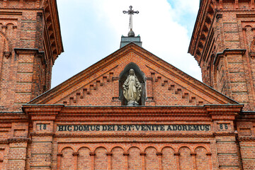 Obraz premium Raciąż, brick Church of St. Wojciech, Poland, Masovian Voivodeship, April 10, 2025