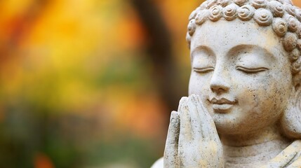 Serene Buddha statue with hands clasped in prayer, set against a blurred autumnal background of warm orange and yellow foliage. : Generative AI