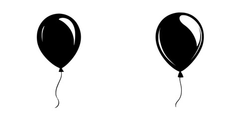 Black balloons floating against a plain white background suitable for party decorations or graphic designs © Andrei
