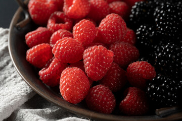 A vibrant mix of fresh raspberries and blackberries—juicy, ripe, and full of flavor